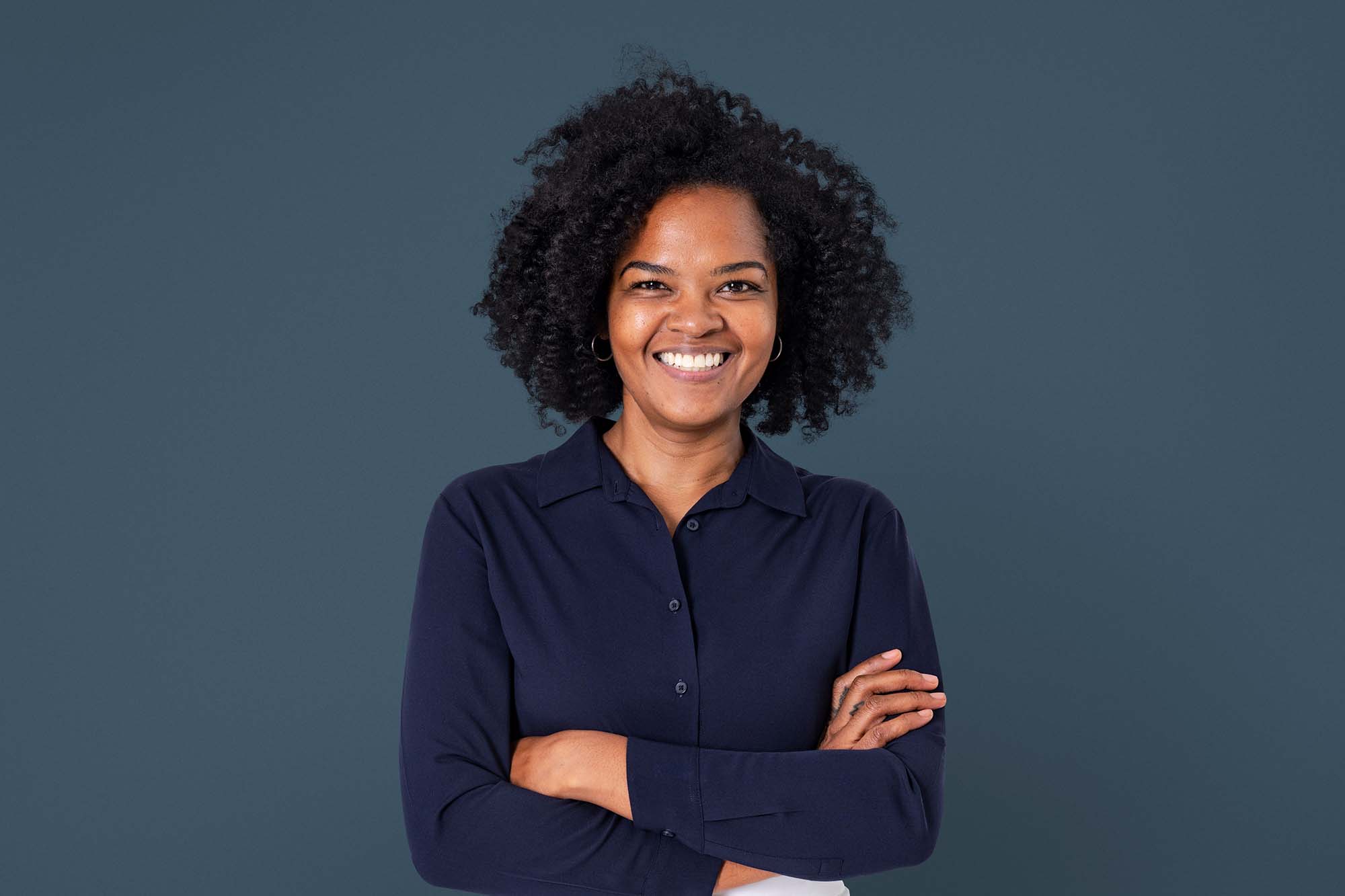 Home Care business owner smiling at the camera. Young black female.
